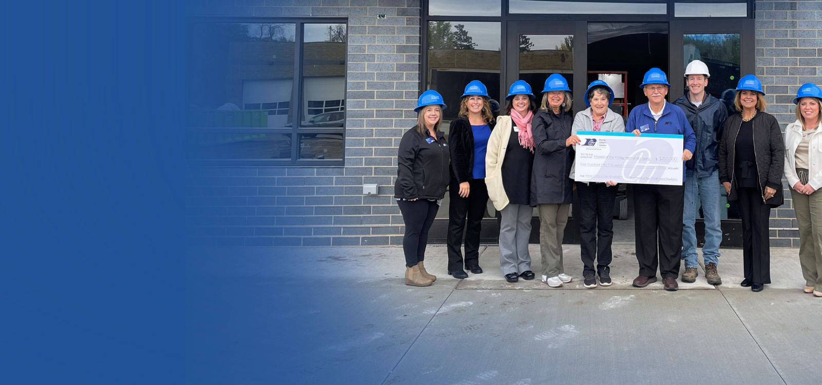 RCU Foundation team holding a big check with a donor