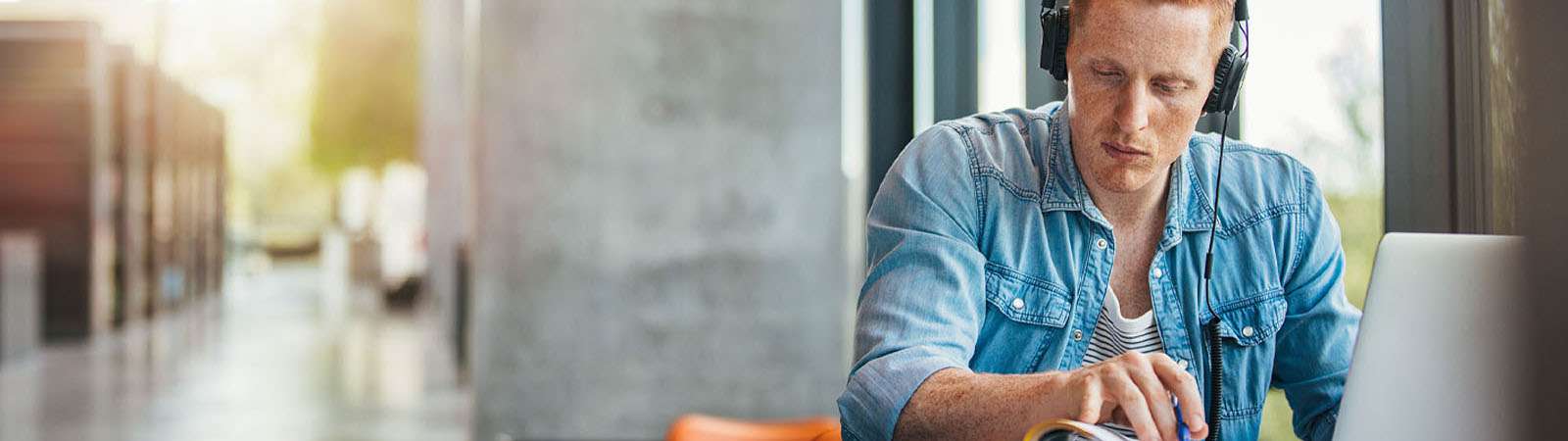 Young man using online education tools