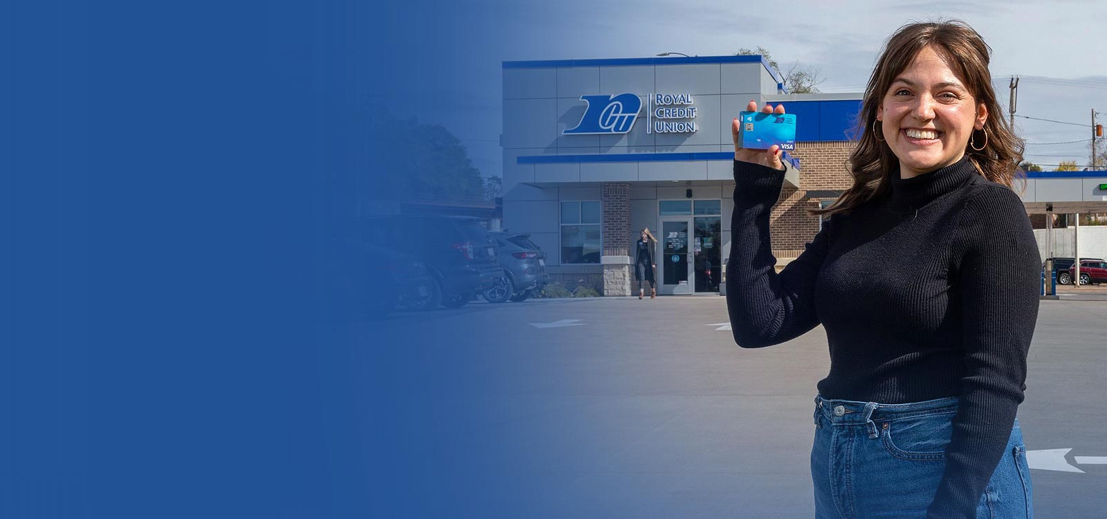 Young man holding an RCU debit card